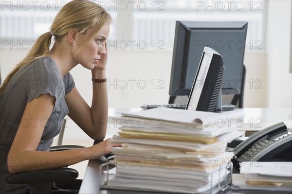Businesswoman looking at computer.