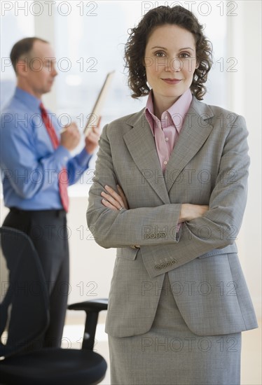 Businesswoman with arms crossed.