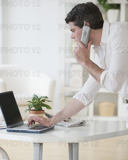 Man talking on telephone.