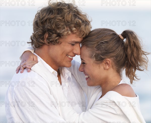 Young couple hugging on beach. Date : 2008