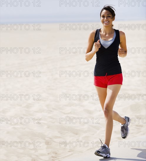 Woman running on beach. Date : 2008