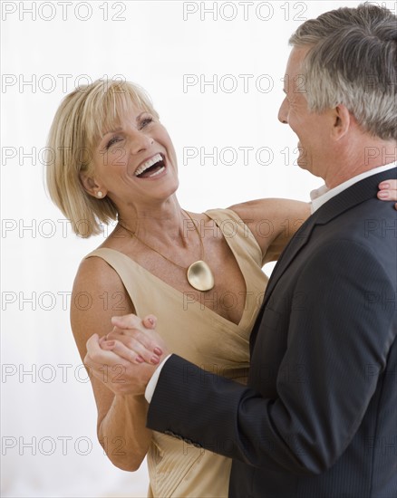 Mature couple dancing.