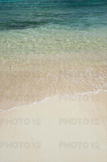 Beach and clear ocean water.