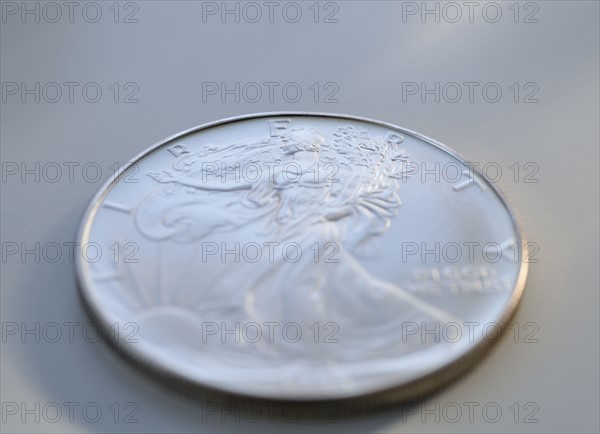 Close up of silver coin.