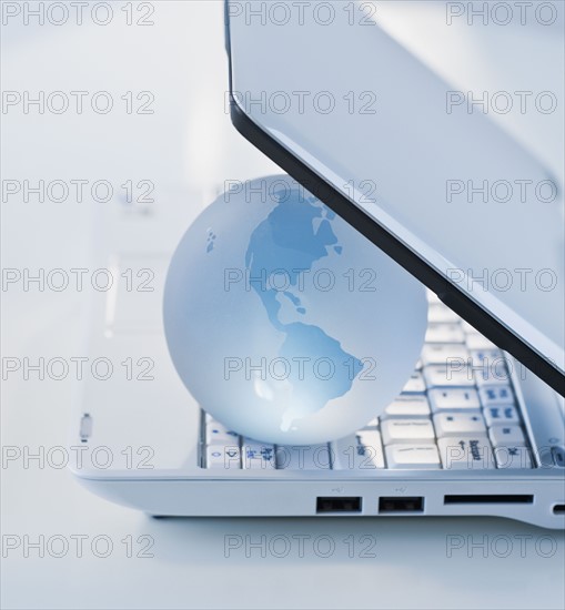 Globe inside laptop.