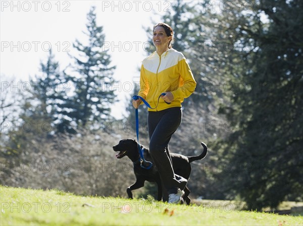 A woman with a dog outdoors