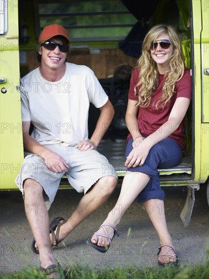 Couple in back of vehicle