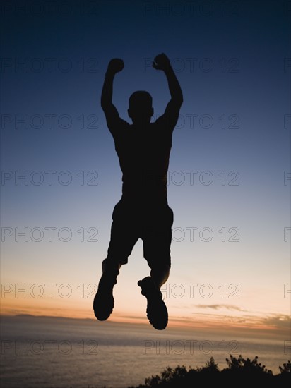 Silhouette of man jumping