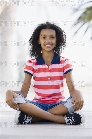 Girl sitting cross legged