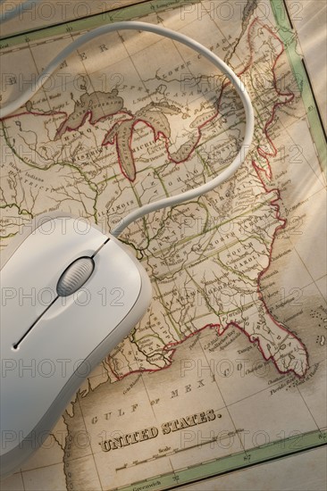 Antique map and computer mouse.