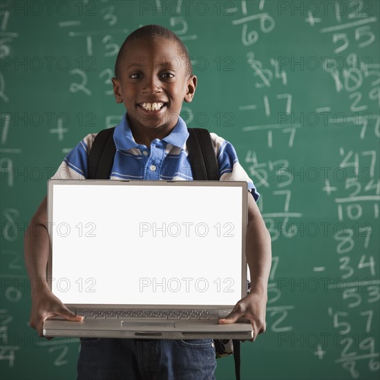 Student holding laptop