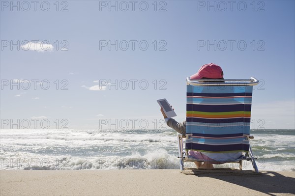 Reading at the beach. Photographer: Chris Hackett