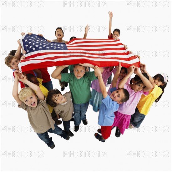 Children holding flag. Photographer: momentimages