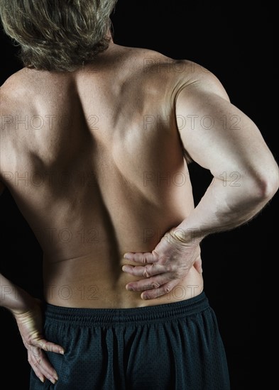 Man with back pain. Photo : Daniel Grill