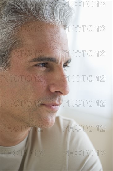Portrait of a grey haired man.