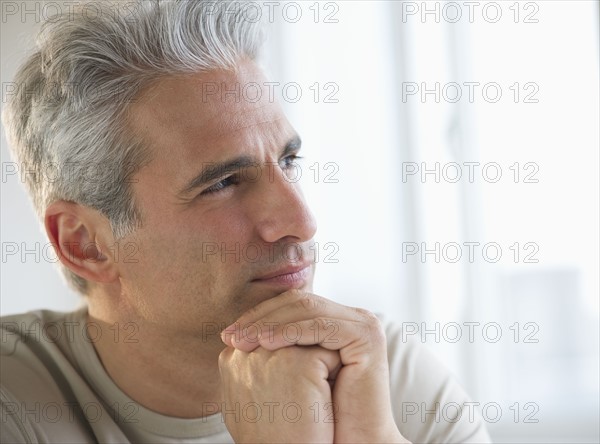 Portrait of a grey haired man.