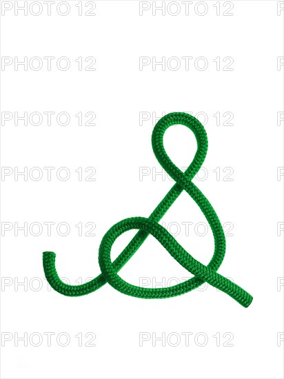 Green rope in the shape of a letter S. Photo. David Arky