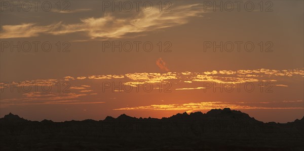 USA, South Dakota, Mountains in Badlands National Park at sunset.