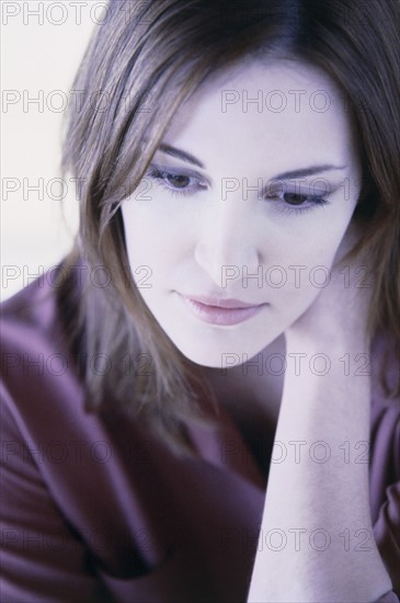 Pensive woman. Photo : Fisher Litwin