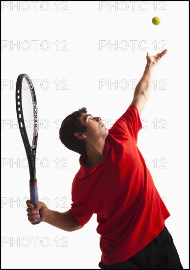 Young man playing tenni