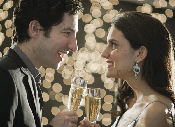 Young happy couple celebrating New Year's Eve.