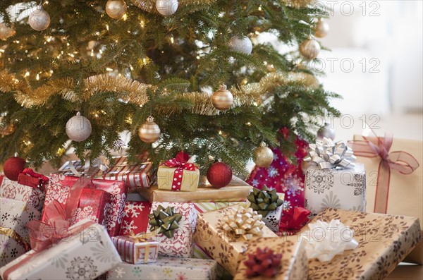 Colorful gifts under christmas tree.