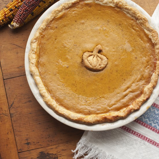 Close up of pumpkin pie on table.