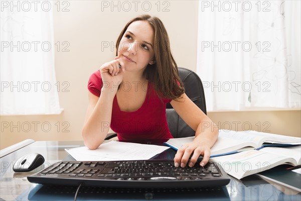 Young woman studying. Photo : Mike Kemp