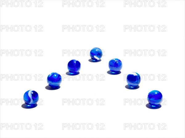 Blue glass balls in a row. Photo: David Arky
