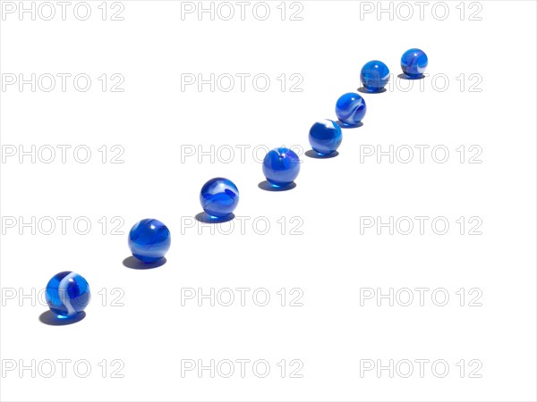 Blue glass balls in a row. Photo: David Arky