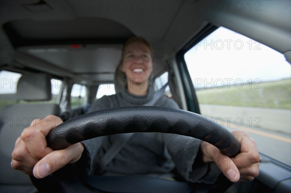 Mid adult woman driving. Photo: Noah Clayton