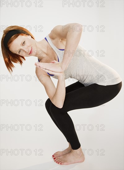 Woman doing yoga position. Photo: Jamie Grill Photography