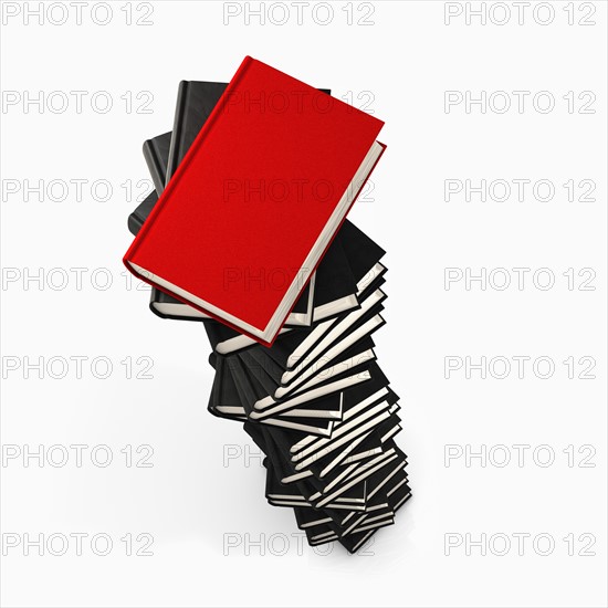 Stack of grey books and one red. Photo: Jon Boyes