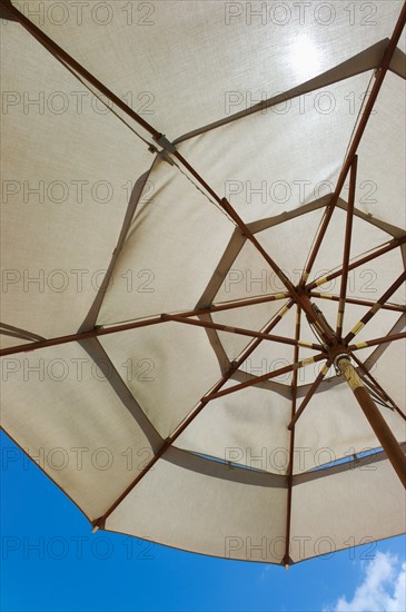 Sunshade against blue sky.