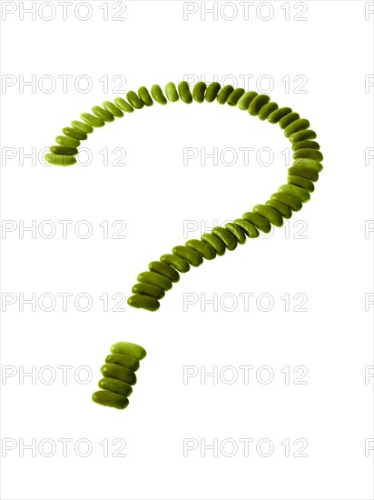 Studio shot of Bean Seeds making Question Mark on white background. Photo : David Arky