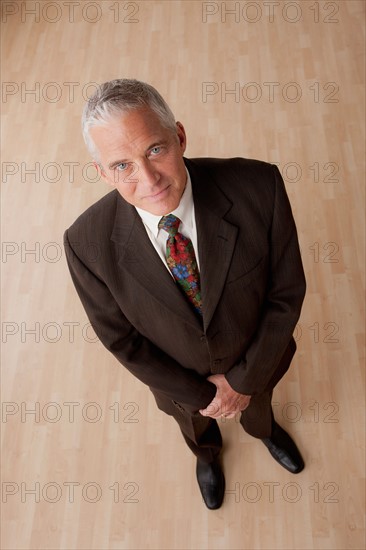 Portrait of smiling senior businessman. Photo: Rob Lewine