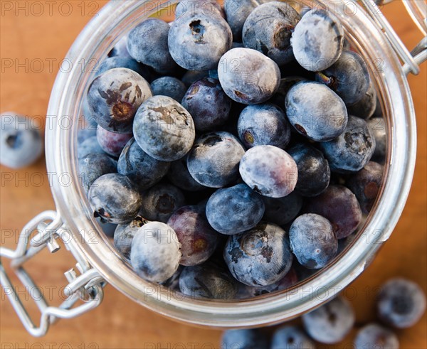 Close up of frozen blueberries in jar. Photo: Jamie Grill