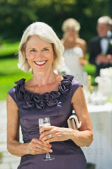 Portrait of mother of bride at wedding reception.