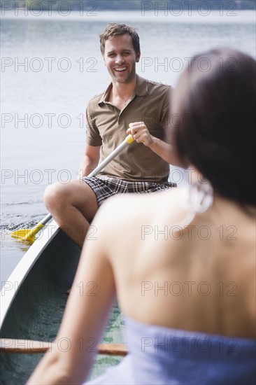 Roaring Brook Lake, Couple in boat on lake. Photo : Jamie Grill