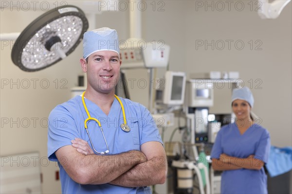 Portrait of male and female surgeons in operating room. Photo: db2stock