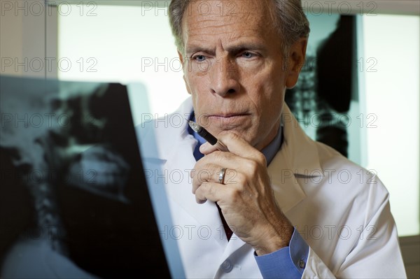 Doctor looking at x-ray. Photo: db2stock