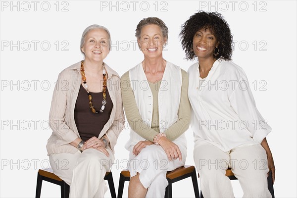 Studio portrait of three women. Photo : Rob Lewine