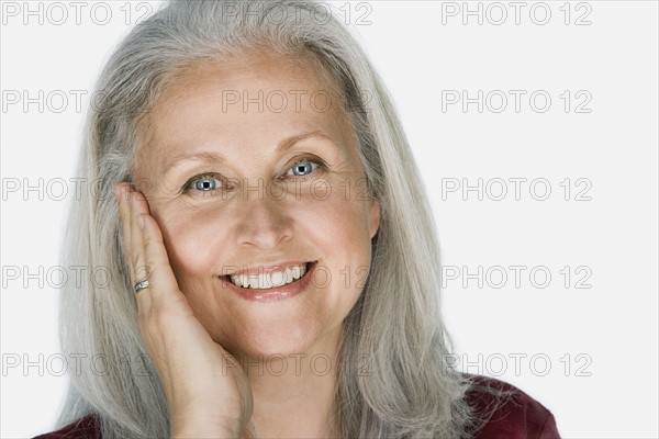 Studio portrait of mature woman. Photo : Rob Lewine