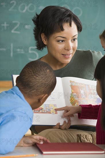 Teacher and children (6-7) at school. Photo : Rob Lewine