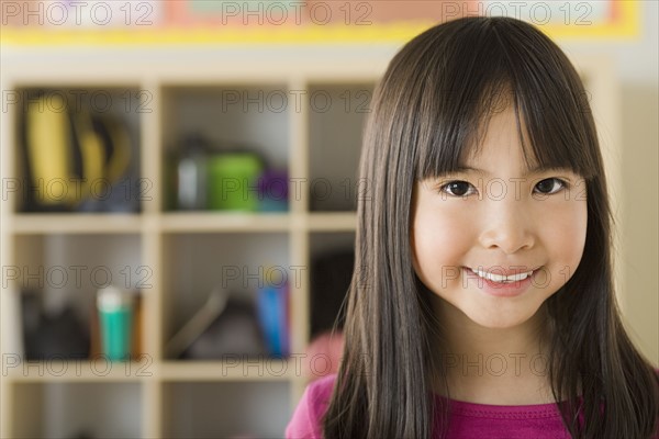 Portrait of girl (6-7) in school. Photo: Rob Lewine