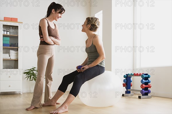 Women talking in gym. Photo: Rob Lewine