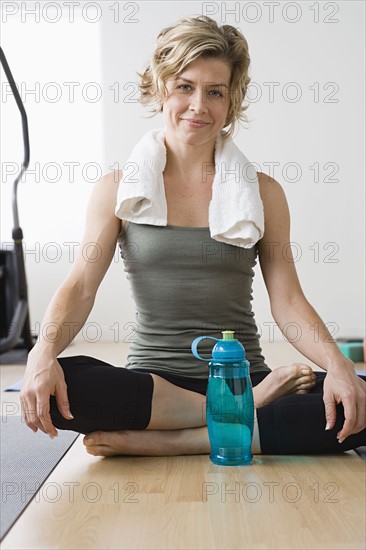 Woman resting in gym. Photo: Rob Lewine