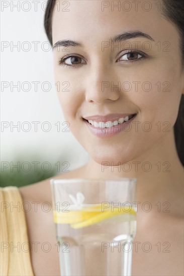 Attractive woman with glass of water. Photo: Rob Lewine