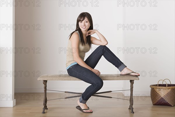 Woman sitting on bench. Photo : Rob Lewine