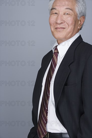 Portrait of happy senior businessman. Photo : Rob Lewine